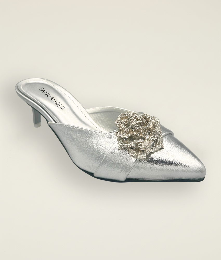 Stylish women’s Silver medium heel slipper featuring satin finish and jeweled flower buckle